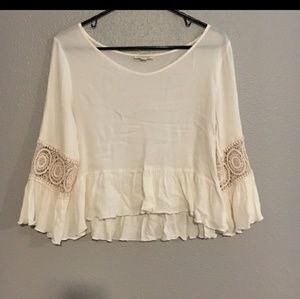 Very cute beige shirt with details on sleeves